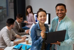 Performance management in India team discussing strategy and tracking employee performance metrics in modern office