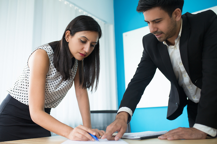 Corporate team discussing emergency CEO replacement and succession planning in office