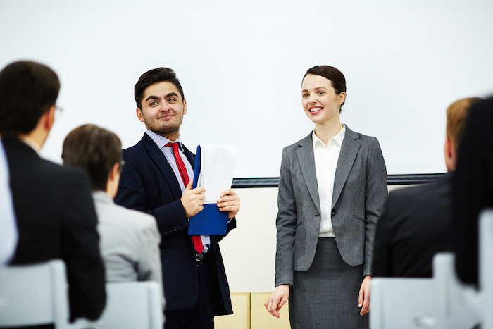 Leadership hiring in Mumbai presentation with business professionals discussing executive recruitment strategy in a corporate meeting room.